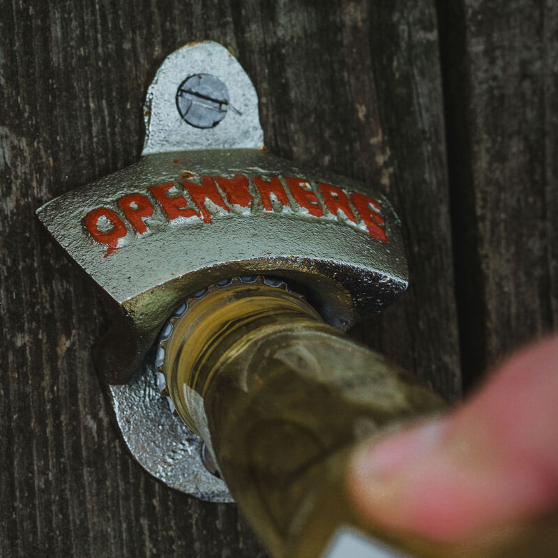 Flaskeåpner "Open here" Sølv