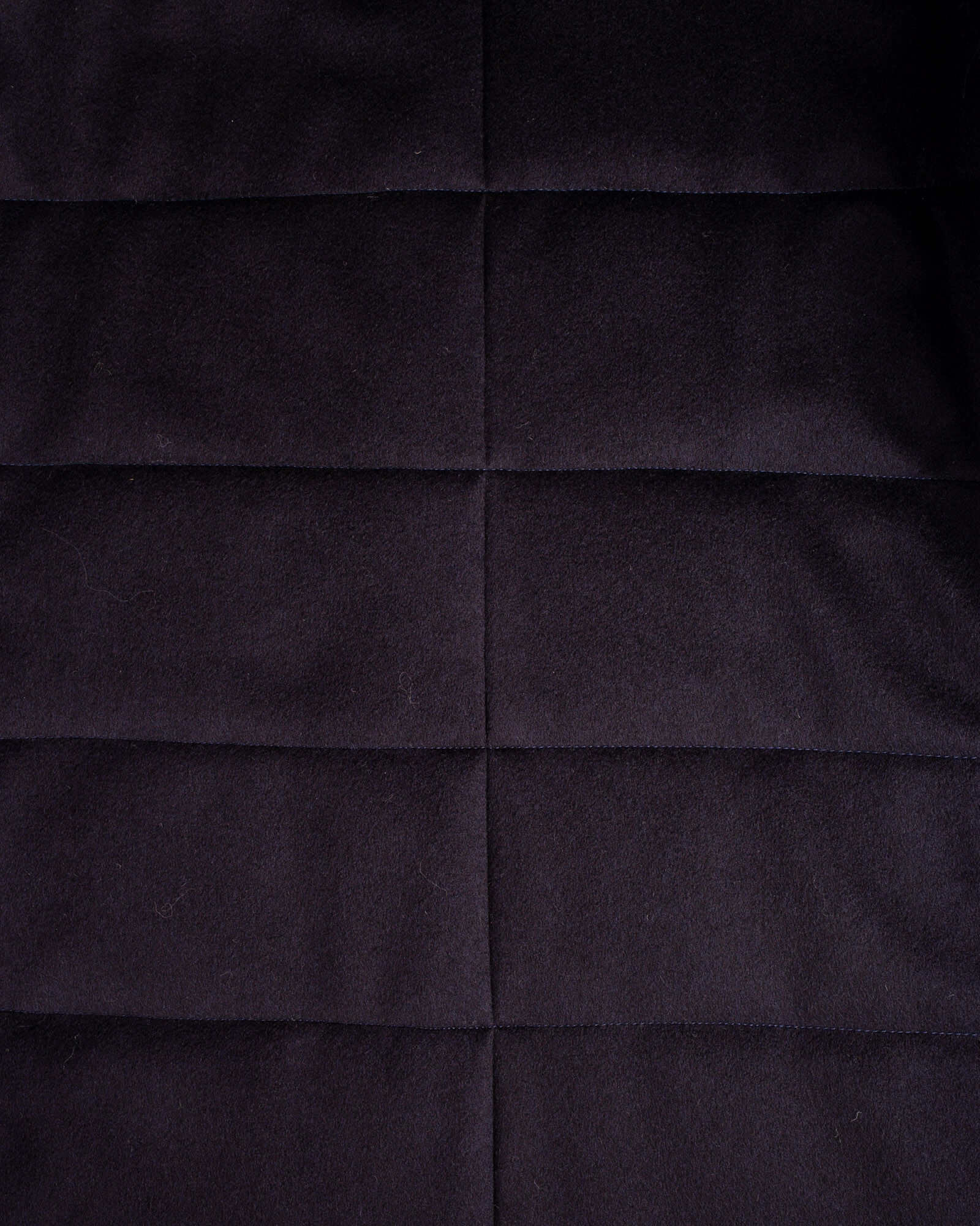 Closeup of back of Navy padded coat