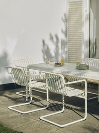 Palissade Cantilever Dining Armchair Cream white powder coated steel