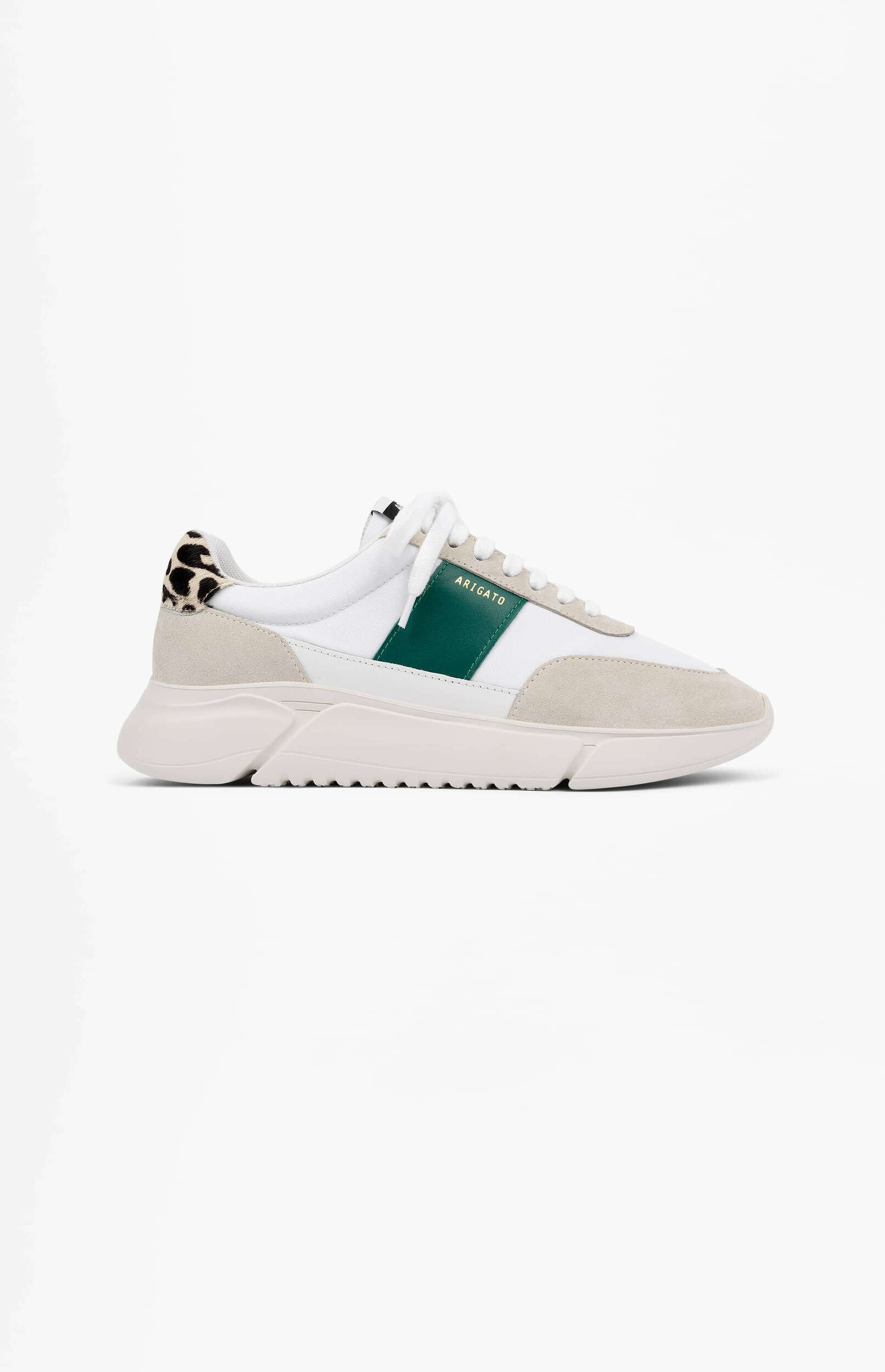 A white and light grey ARIGATO sneaker with a prominent green stripe on the side and a black and white leopard print heel tab. The shoe features white laces, a chunky off-white sole, and a mix of material textures.