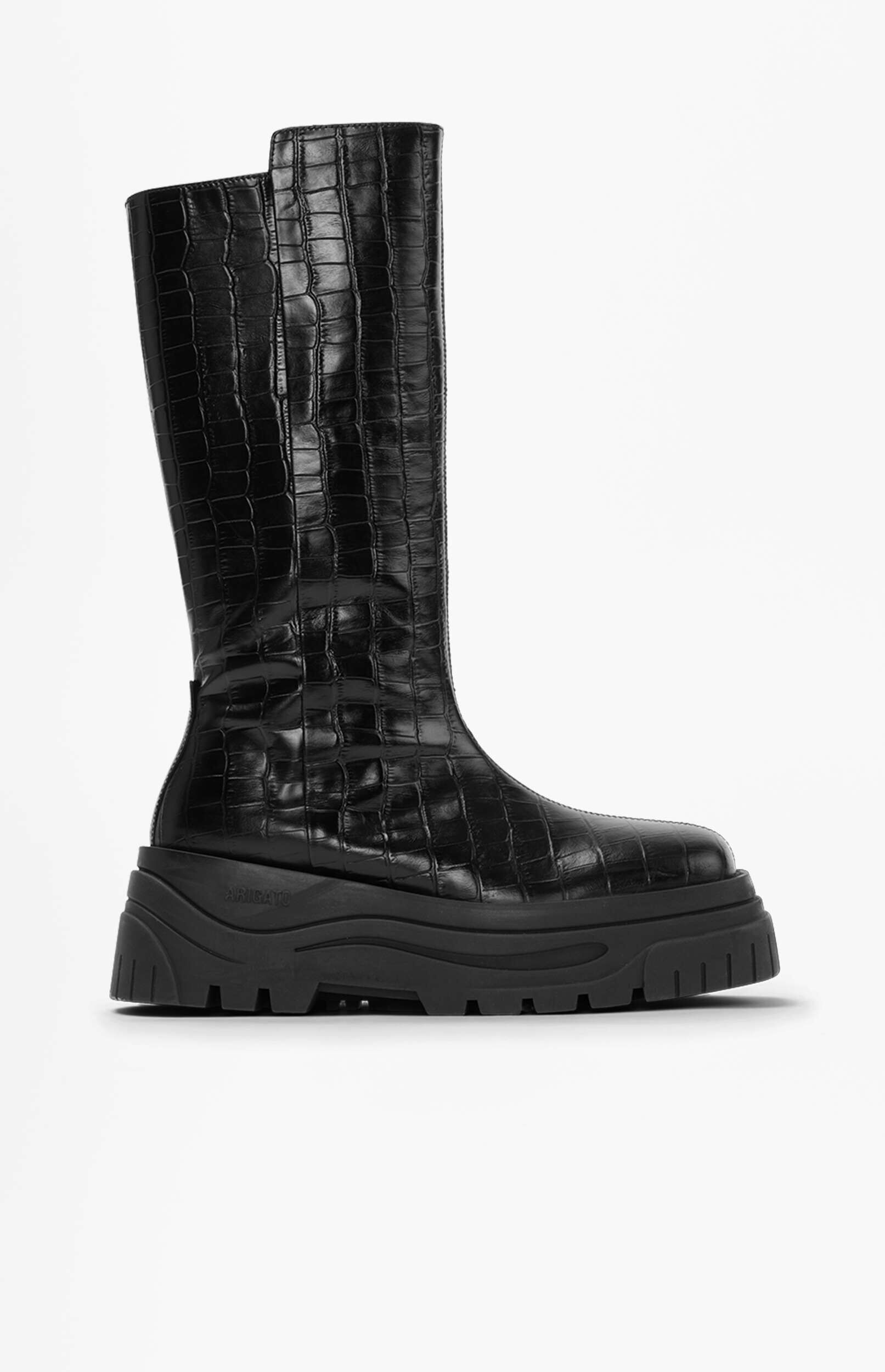 A single black knee-high boot with a crocodile-embossed texture and a chunky black platform sole. The brand 'ARIGATO' is visible on the side.