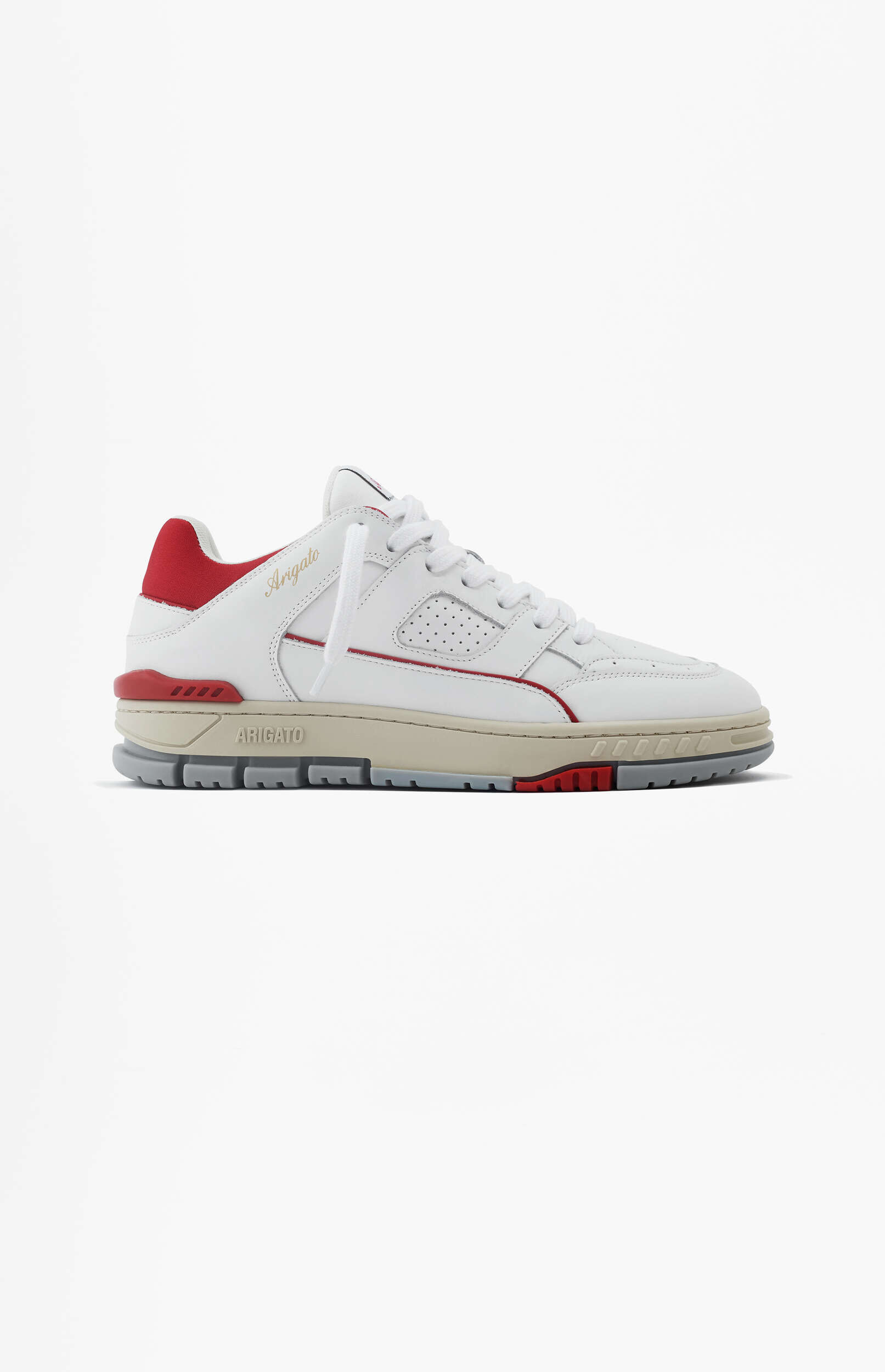 A white Axel Arigato low-top sneaker with red and beige accents, featuring white laces and a multi-textured sole, presented on a clean white background.