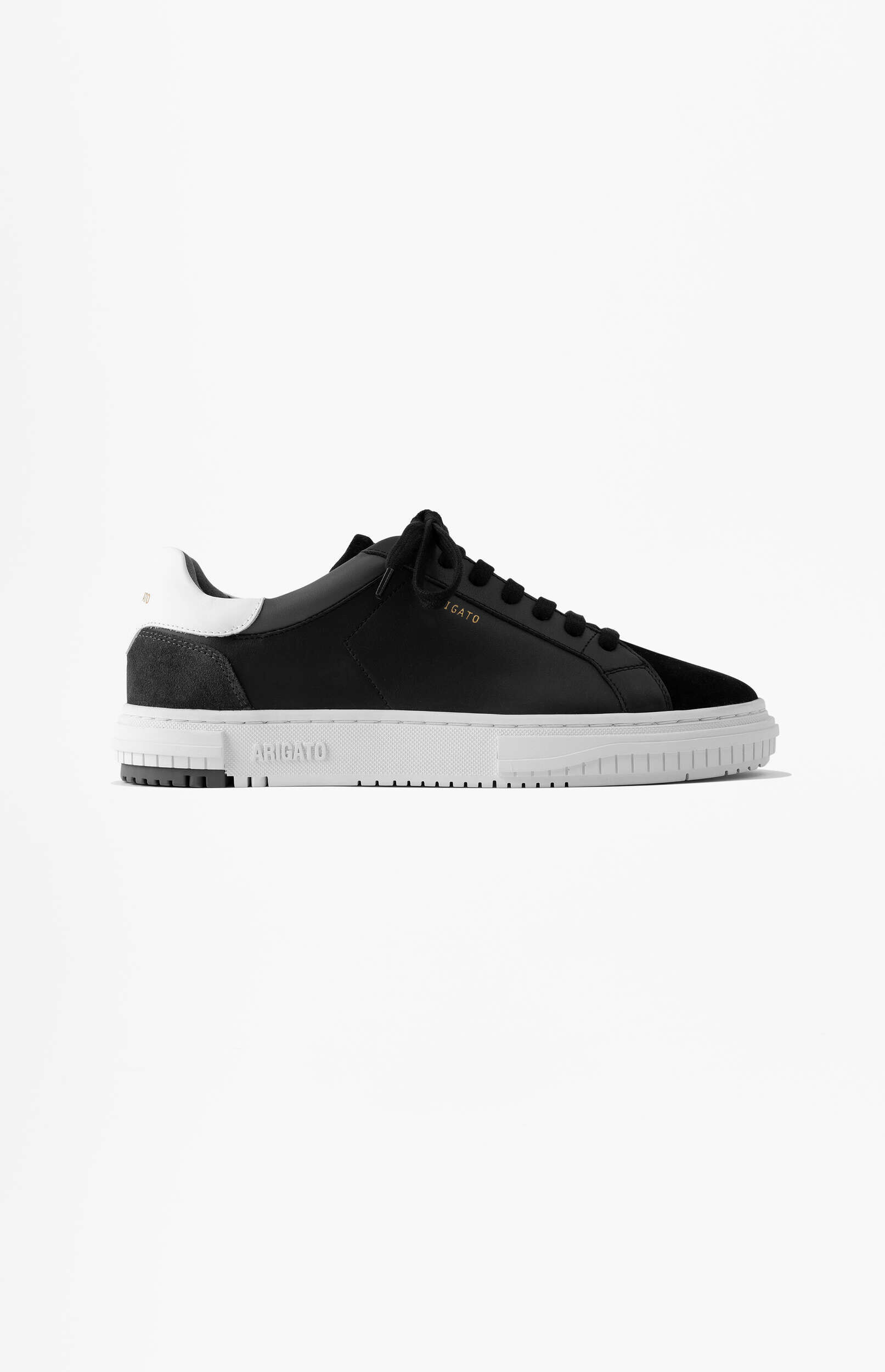 A black Axel Arigato sneaker with a white sole and white heel tab, featuring black laces, against a plain white background.