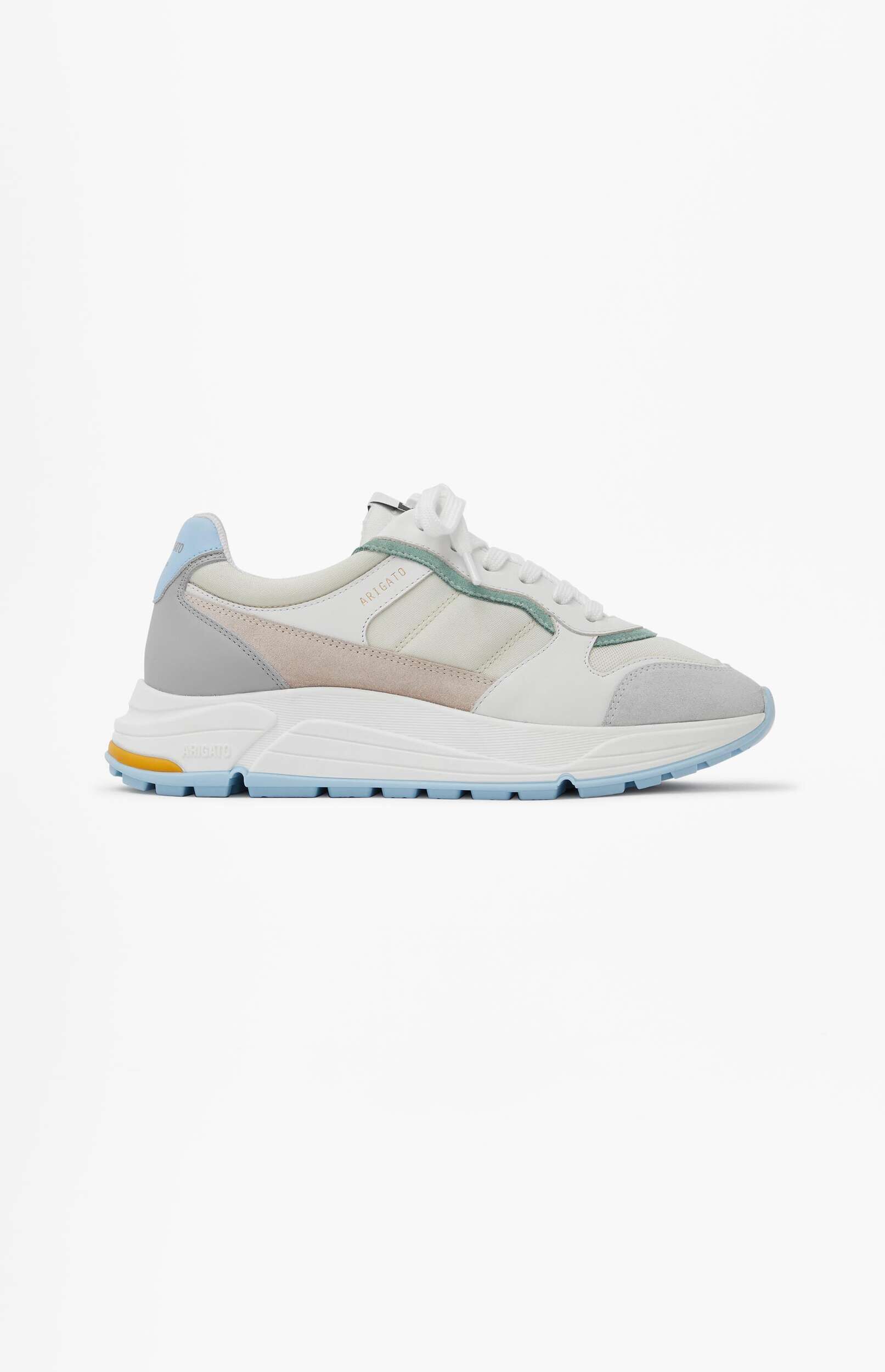 A stylish white, grey, and light blue sneaker with mint green accents and a pale pink suede detail, shown from a side angle on a white background. The sole is light blue with a small yellow detail near the heel.