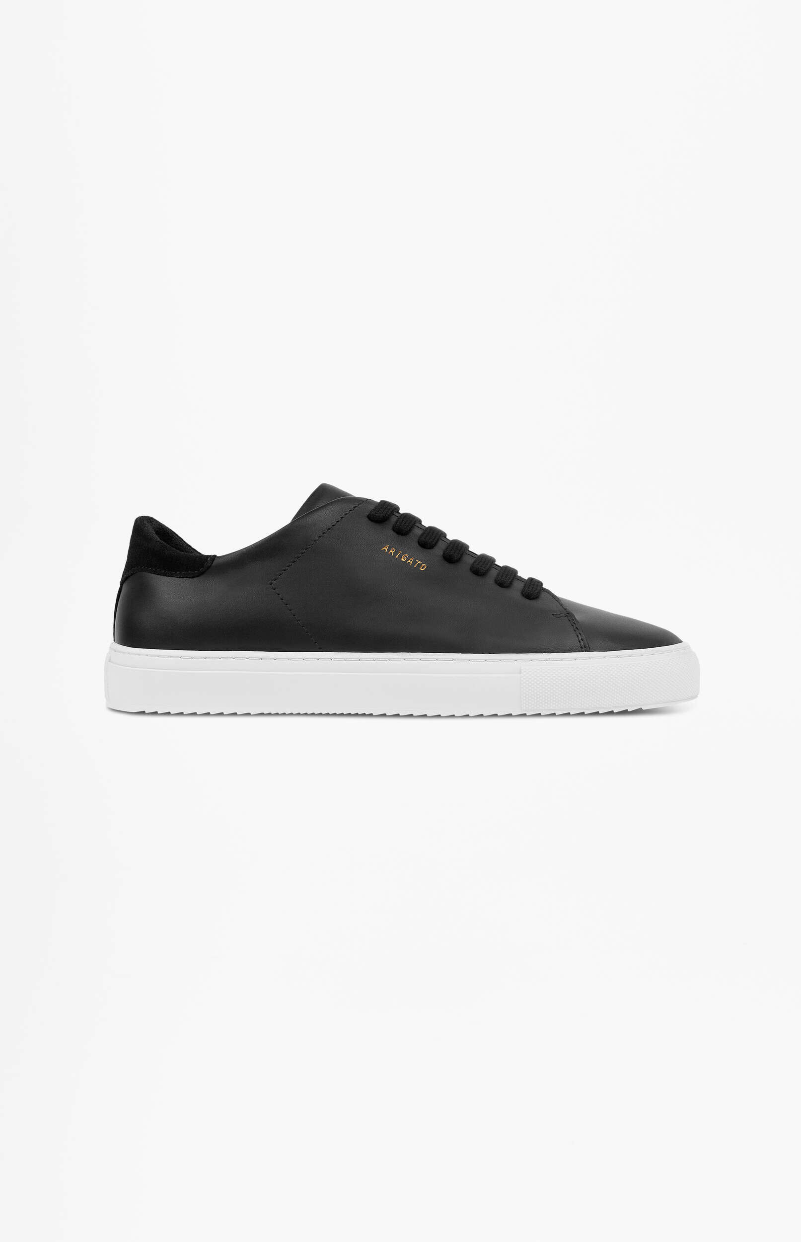 A minimalist black leather sneaker with white soles, black laces, and the brand 'ARIGATO' embossed in gold on the side, displayed on a plain white background.