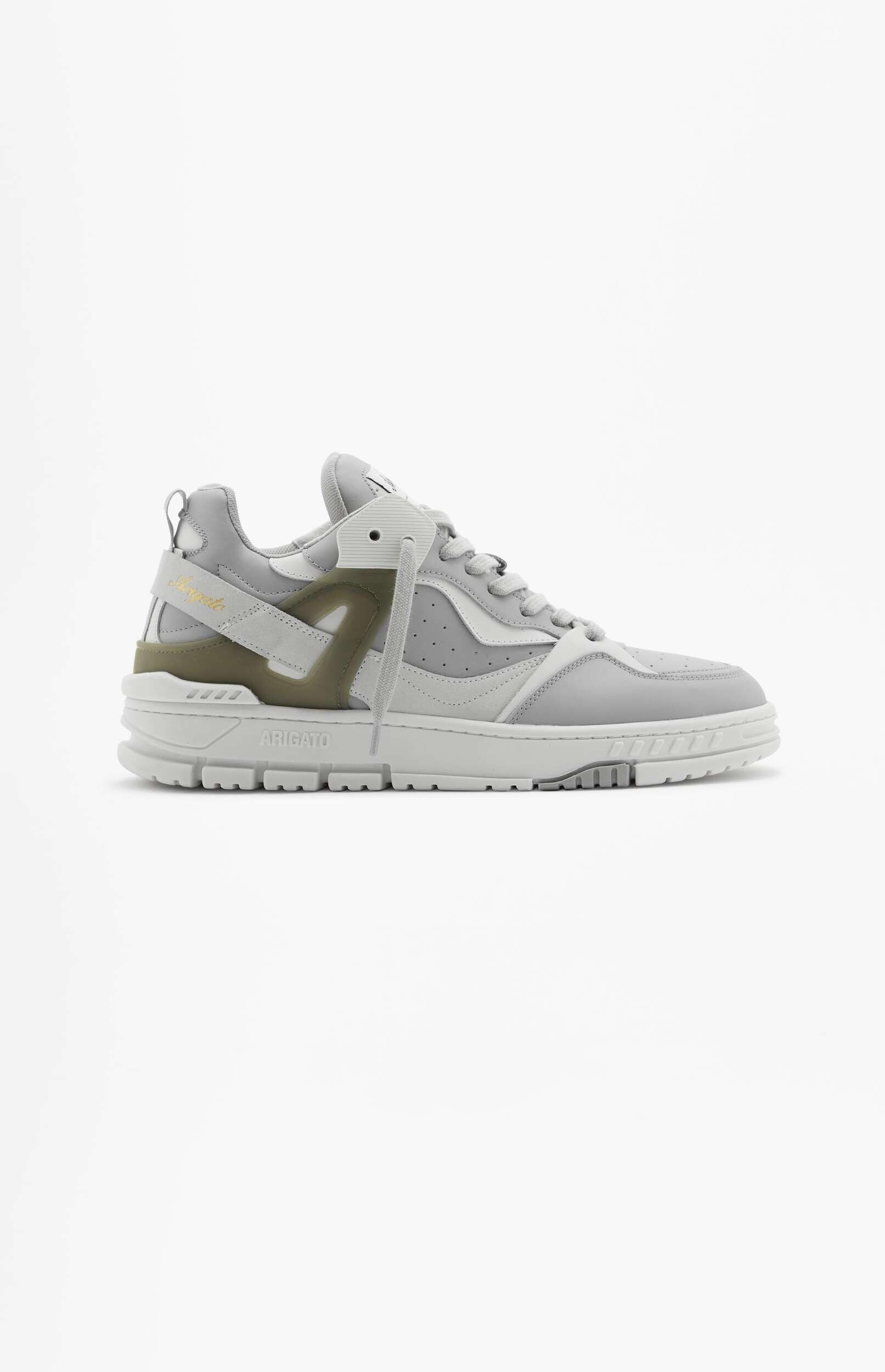 A single light grey and white Axel Arigato sneaker with olive green details and a chunky sole, displayed on a white background.