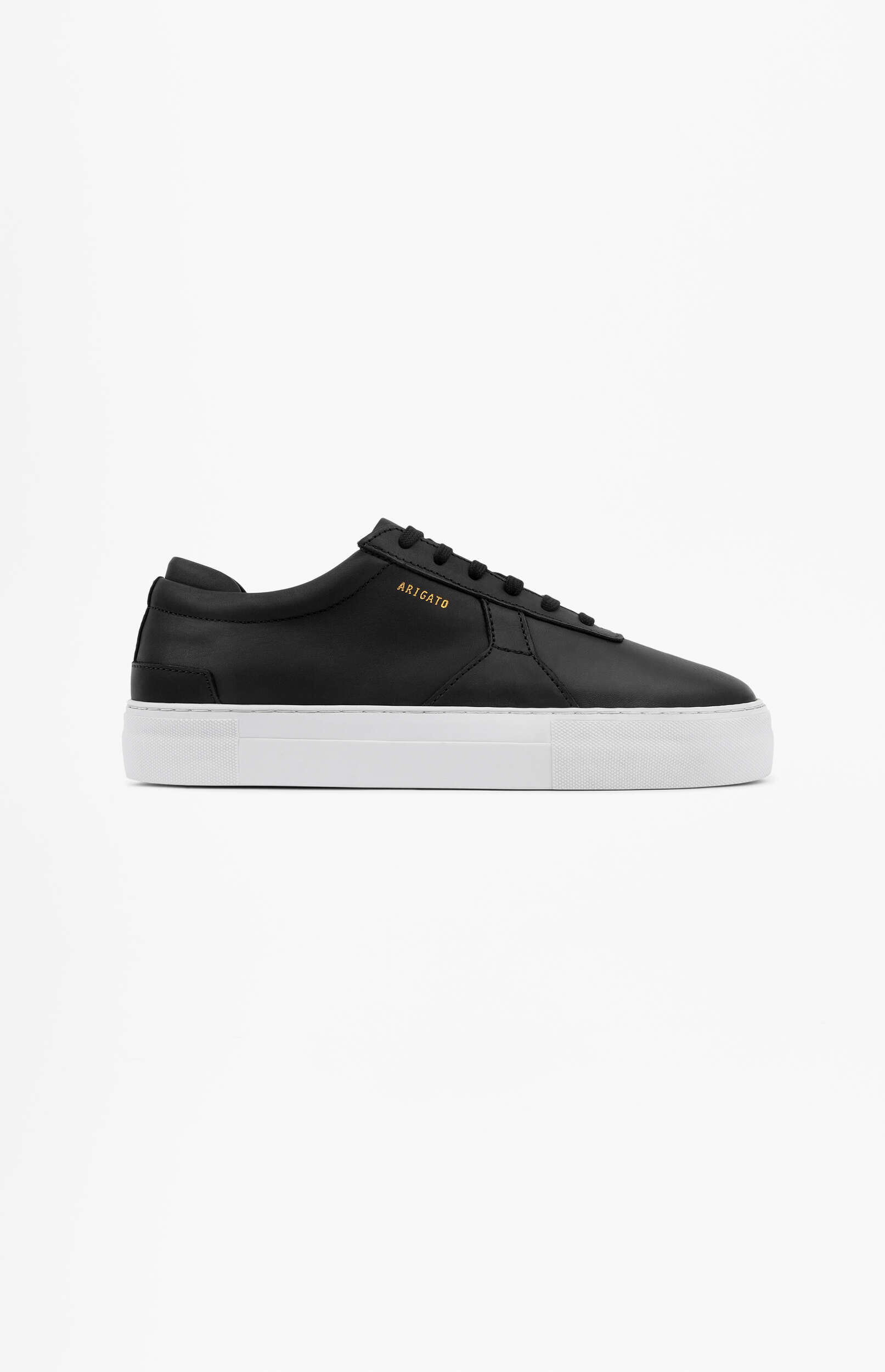 A single black leather sneaker with a thick white platform sole and gold 'ARIGATO' branding on the side, displayed on a clean white background.