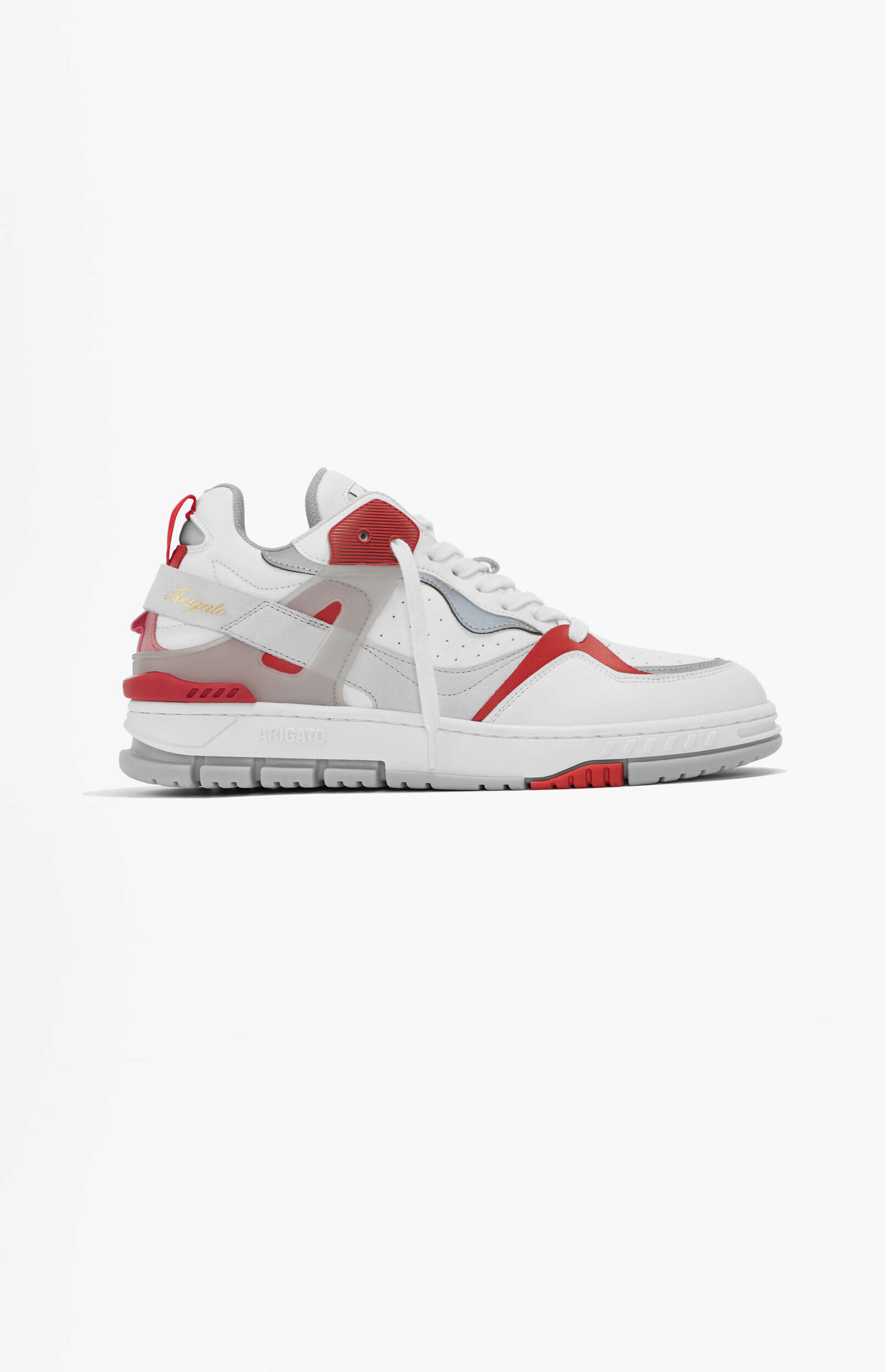 A white sneaker with red and gray details, featuring a chunky sole and 'ARIGATO' branding on the side, shown against a plain white background.