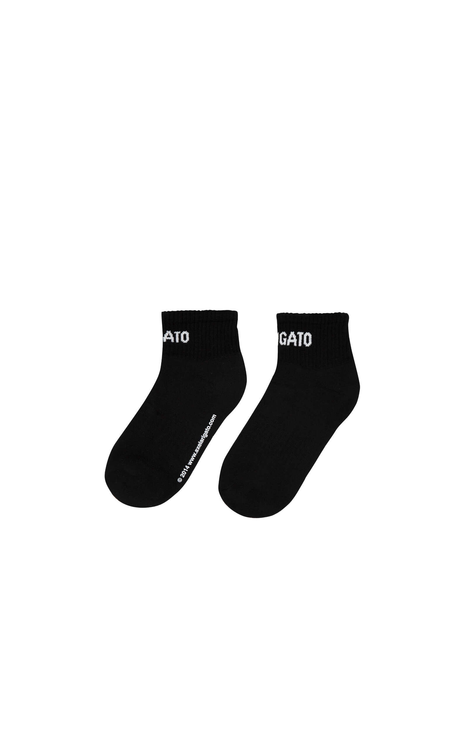A pair of black ankle socks with white 'GATO' lettering on the cuff of each sock. The left sock also displays a small white copyright notice that reads '© 2014 www.axelarlgato.com' along the side.