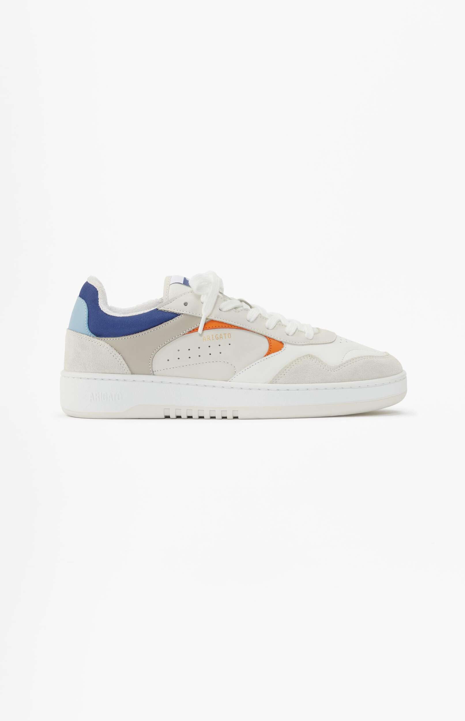 A single Axel Arigato low-top sneaker featuring a predominantly white and light grey design with pops of color. The shoe has white leather and light grey suede panels, a dark blue and light blue accent on the heel, and a prominent orange stripe on the side with 'ARIGATO' in gold text. The brand name is also embossed on the white sole. The sneaker is shown in a side view against a clean white background.