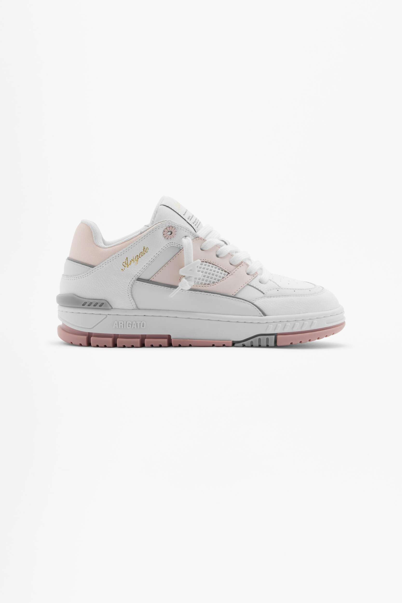 A white and light pink low-top sneaker by Arigato, featuring a chunky pink and gray sole, white leather upper with pink accents, mesh panels, and white laces, displayed on a plain white background.