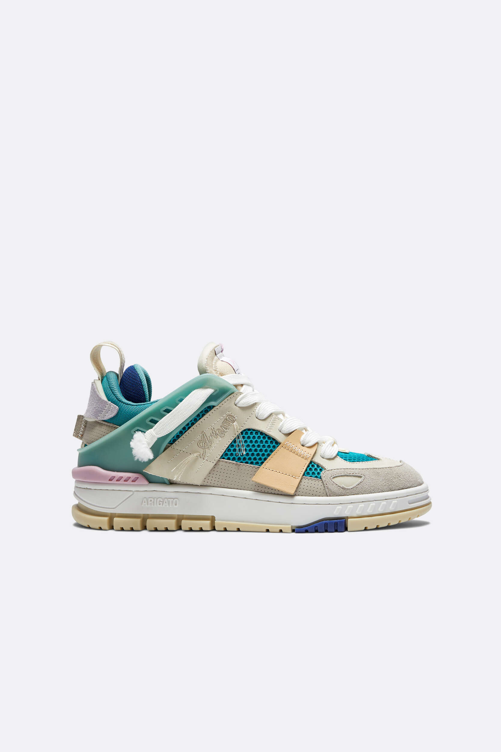 A single Axel Arigato sneaker, viewed from the side, on a plain white background. The shoe features a multi-textured design with elements of off-white suede and leather, teal mesh, and a translucent teal overlay that acts as an eye stay. The chunky sole is cream-colored with visible branding 'ARIGATO' on the side, and there are subtle accents of light pink near the heel and a dark blue on the front part of the outsole. White laces complete the look.