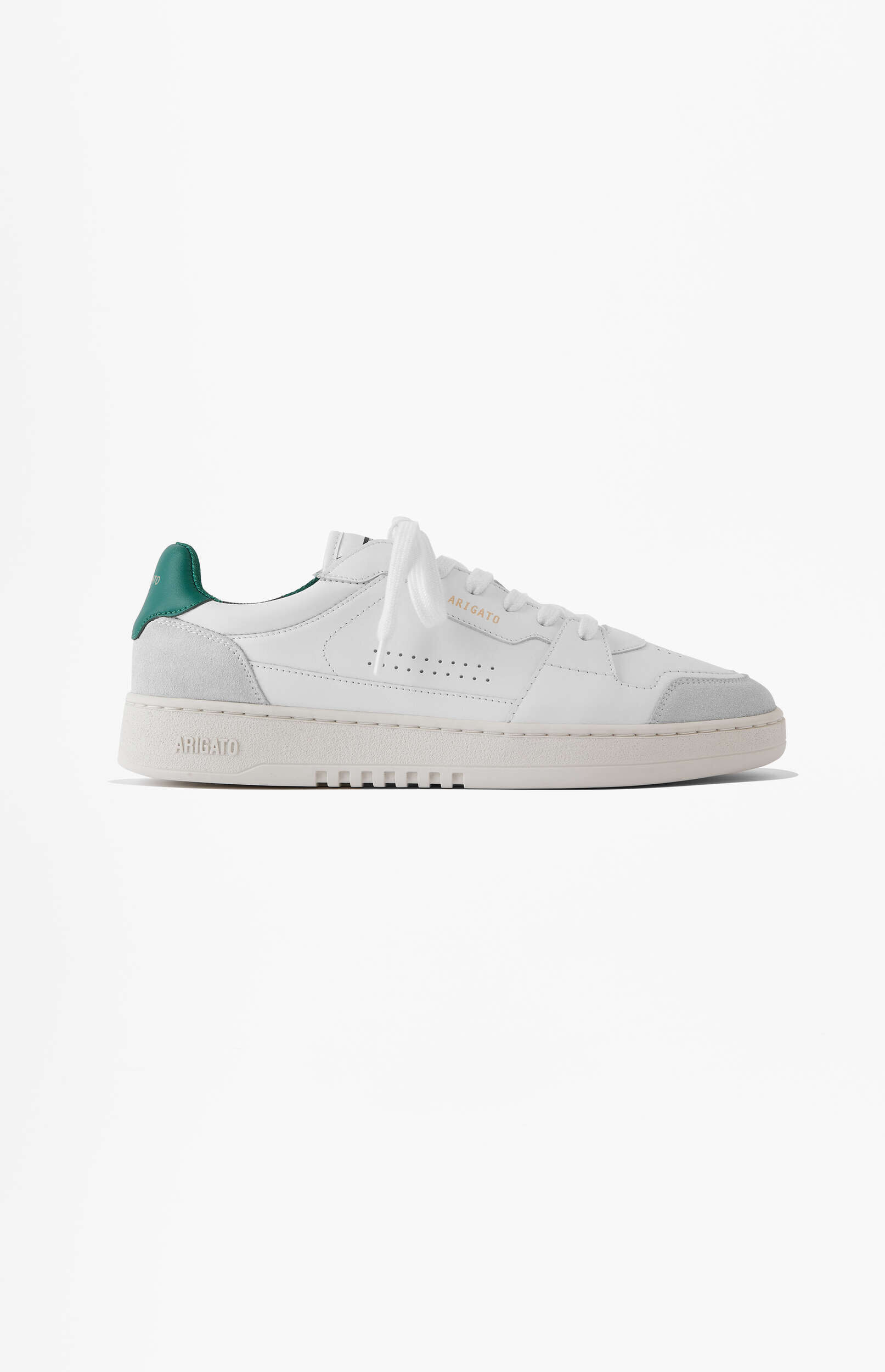A white Axel Arigato sneaker with a green heel tab and light grey suede details, placed on a clean white background.