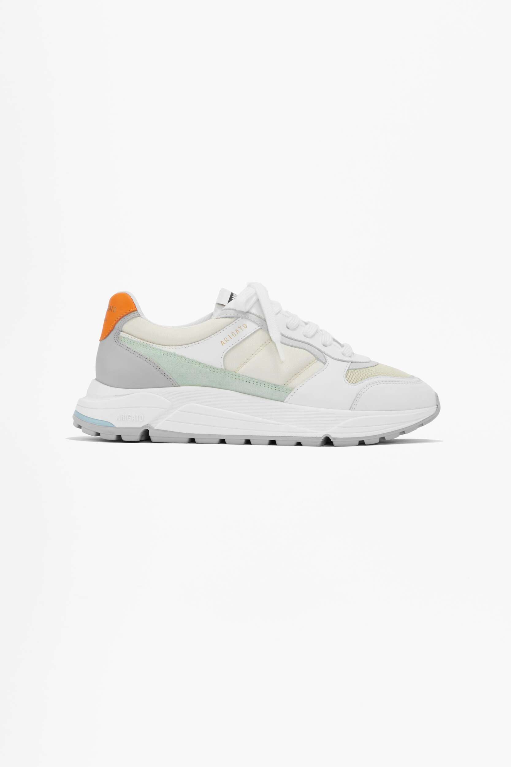 A white Axel Arigato Genesis sneaker featuring light mint green, light gray, and orange accents, with a chunky white midsole and a textured gray outsole, presented on a clean white background.
