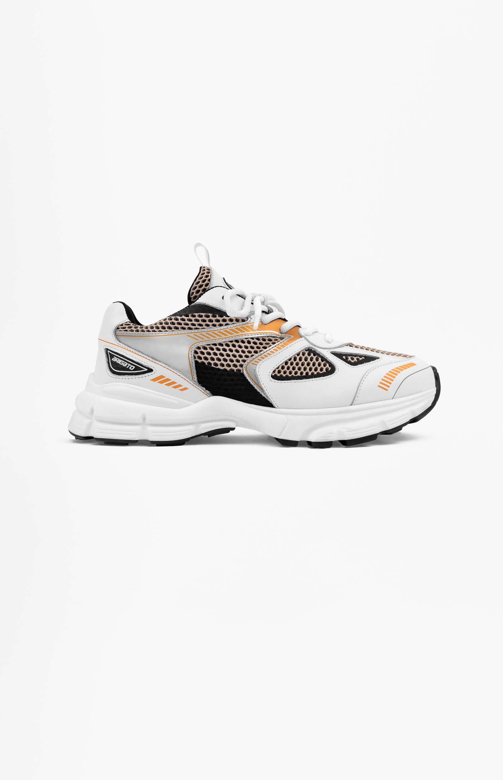 A white, black, and orange athletic sneaker from the brand ARIGATO, featuring a chunky white sole, black mesh panels, and orange striped accents, displayed on a clean white background.