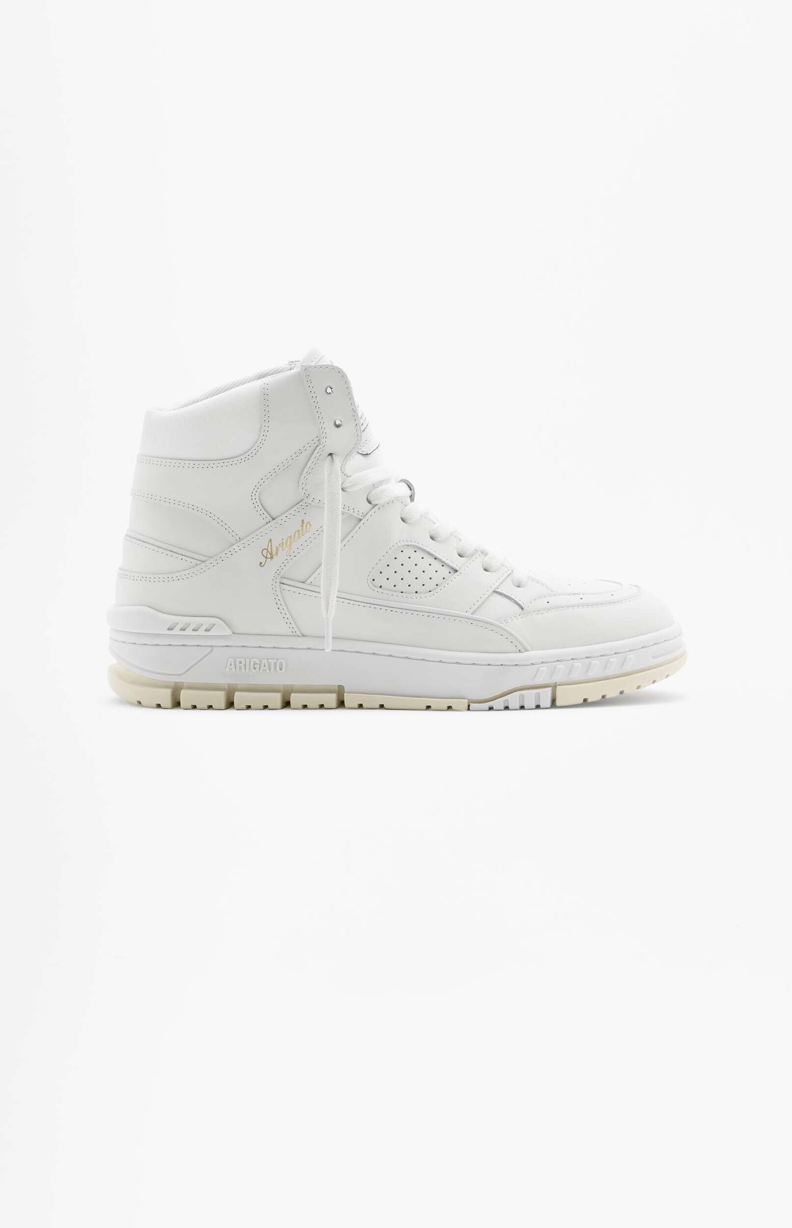 A single white high-top leather sneaker with a cream-colored sole, displayed in a side profile against a plain white background. The word 'Arigato' is visible in gold script on the side of the shoe, and 'ARIGATO' is embossed on the heel section of the sole.