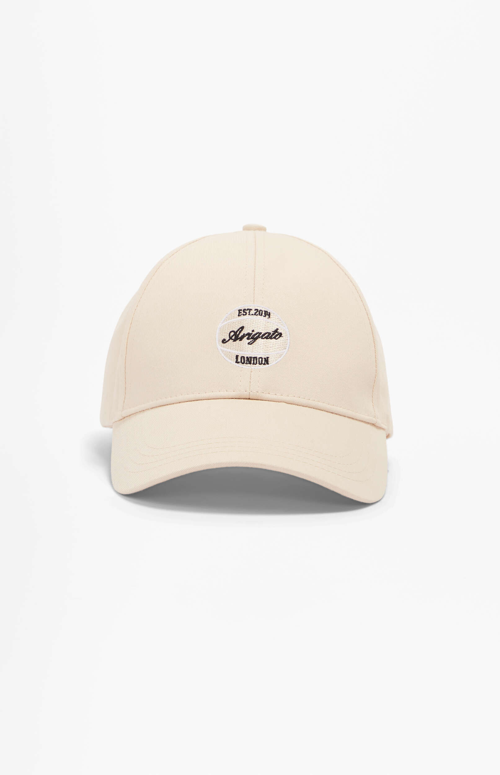 A light cream-colored baseball cap featuring a black and white oval embroidered logo that reads 'EST. 2014', 'Arigato' in a script font, and 'LONDON' in block letters. The cap is centered on a white background.
