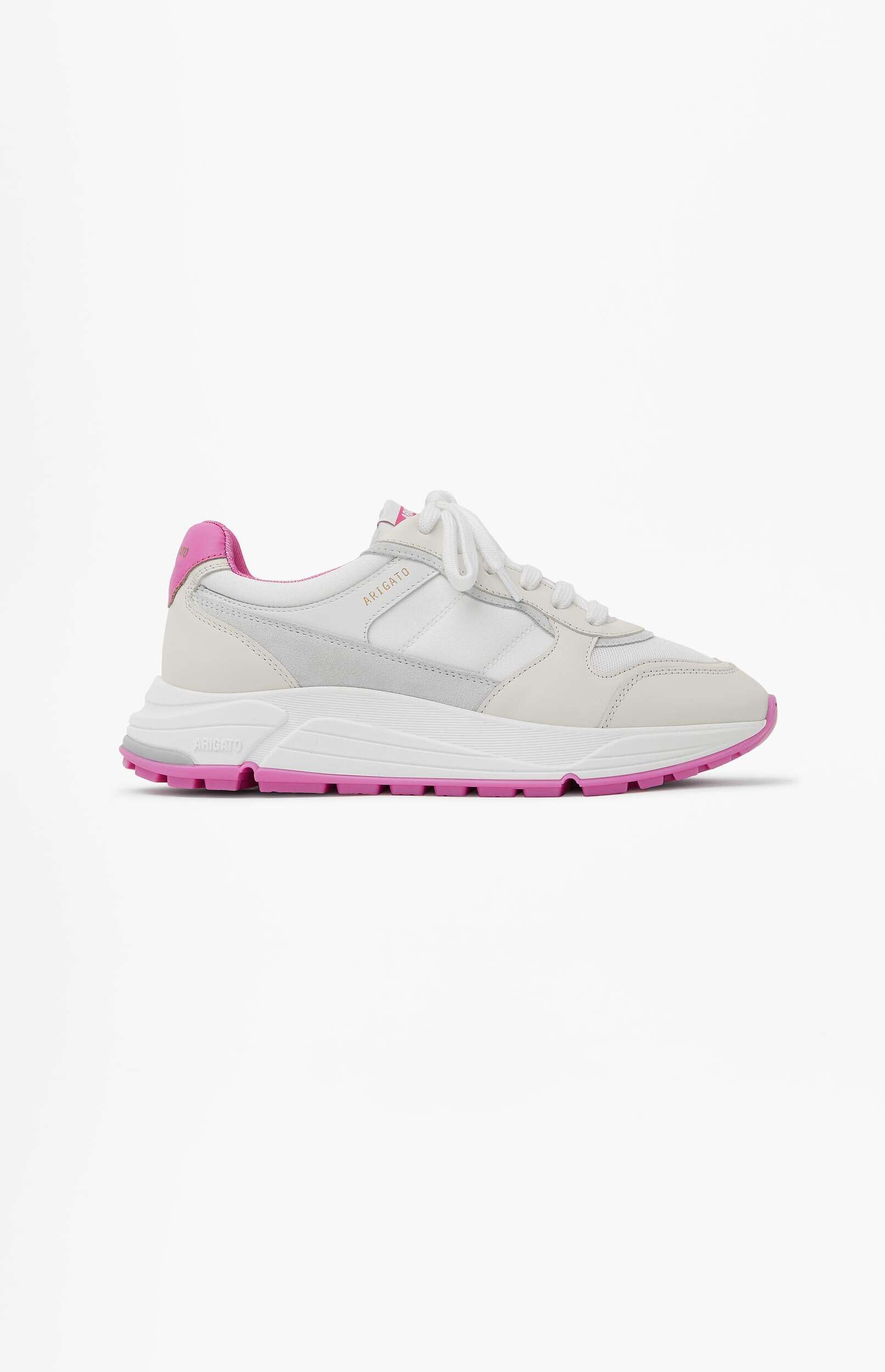 A white and light grey Arigato Genesis sneaker with vibrant pink sole and heel accents, featuring white laces and a chunky sole design, displayed against a clean white background.