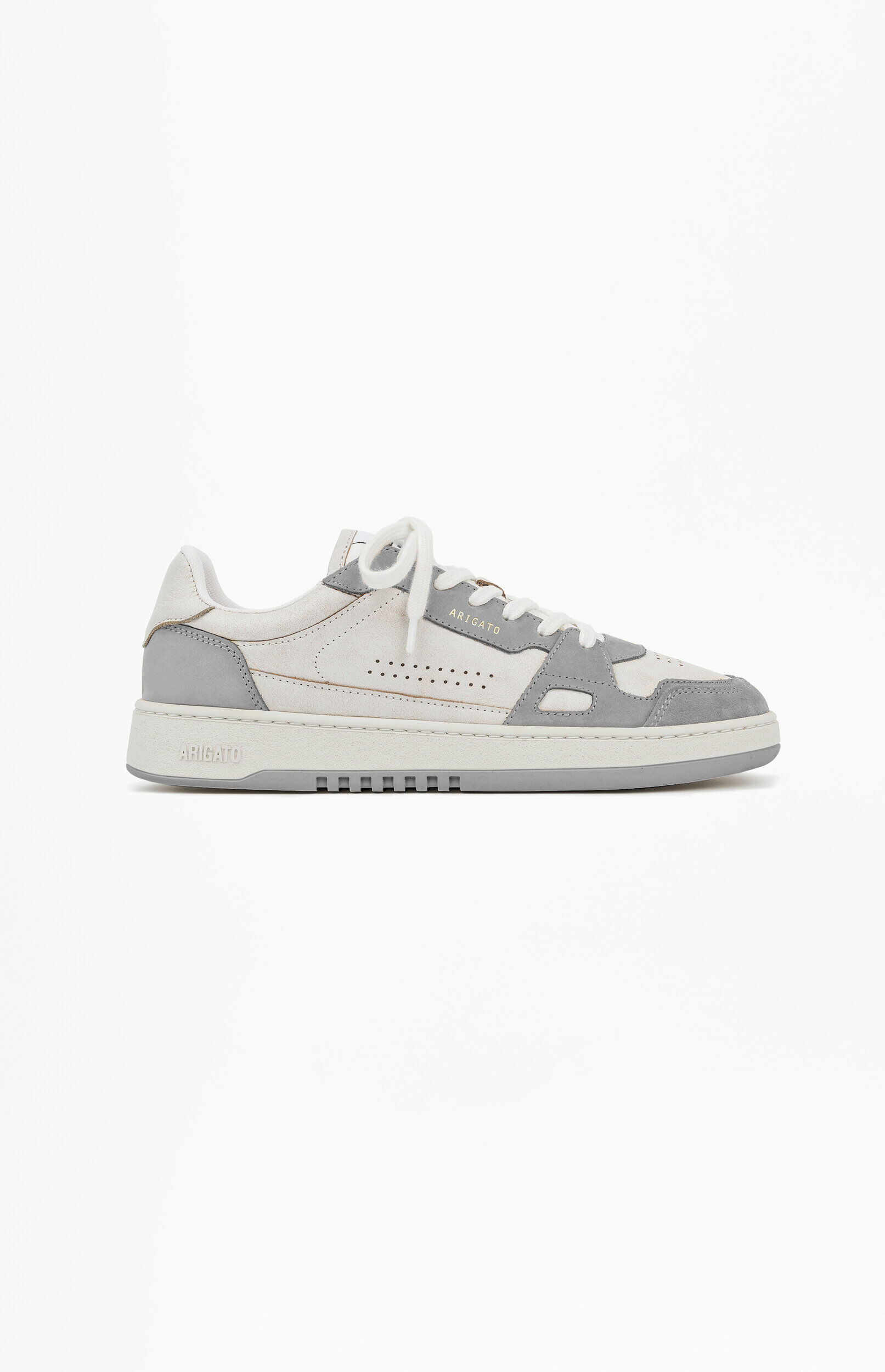 A single Axel Arigato low-top sneaker in off-white and light grey, featuring a retro design with leather and suede panels, white laces, and a thick sole, placed on a plain white background.