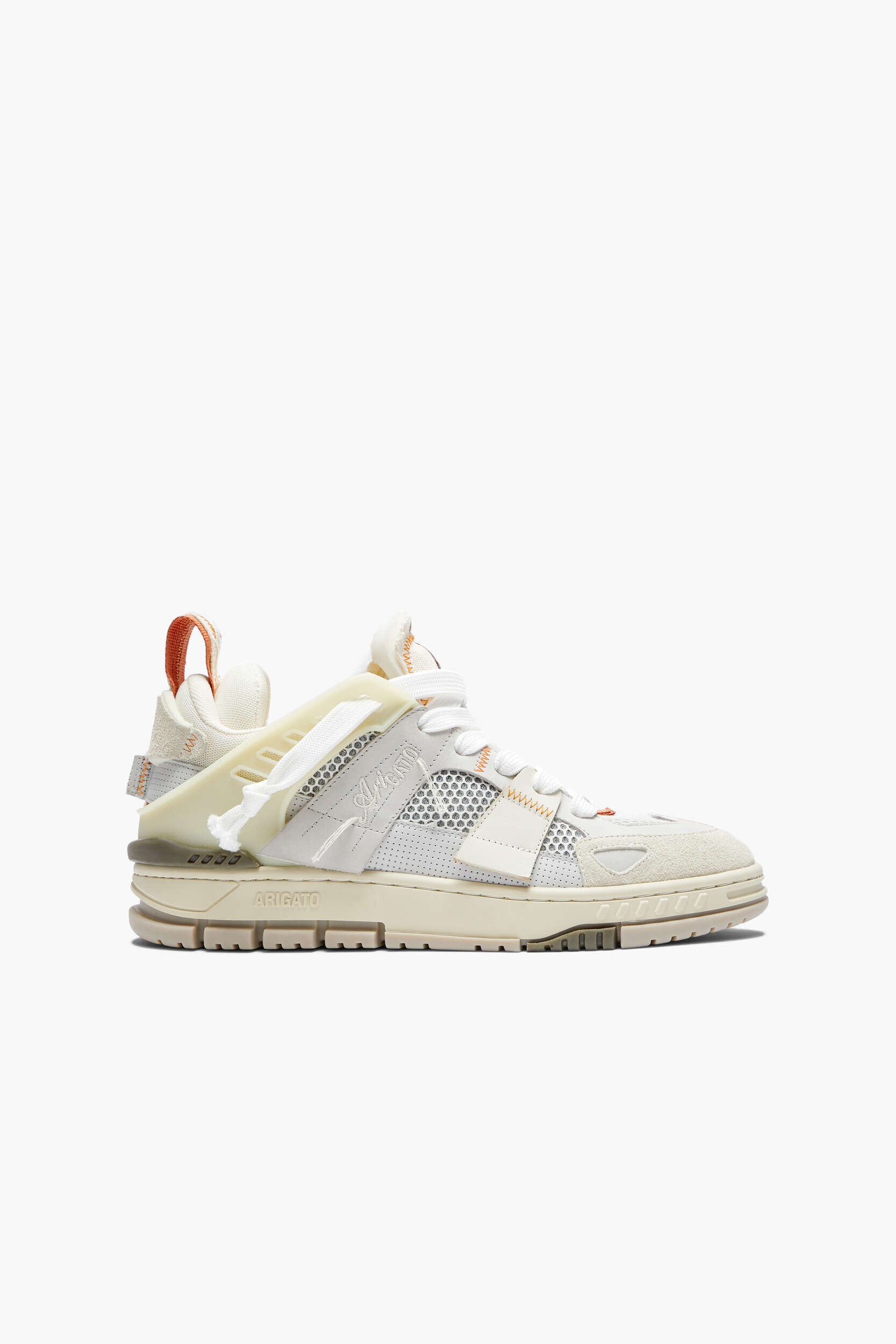 A side view of a single Axel Arigato Genesis sneaker on a white background. The sneaker is off-white and cream with subtle orange stitching and pull tab details. It features a mixed-material upper with mesh panels, suede sections, and textured overlays, along with a prominent translucent lacing structure and a chunky, multi-layered sole with a ridged tread.