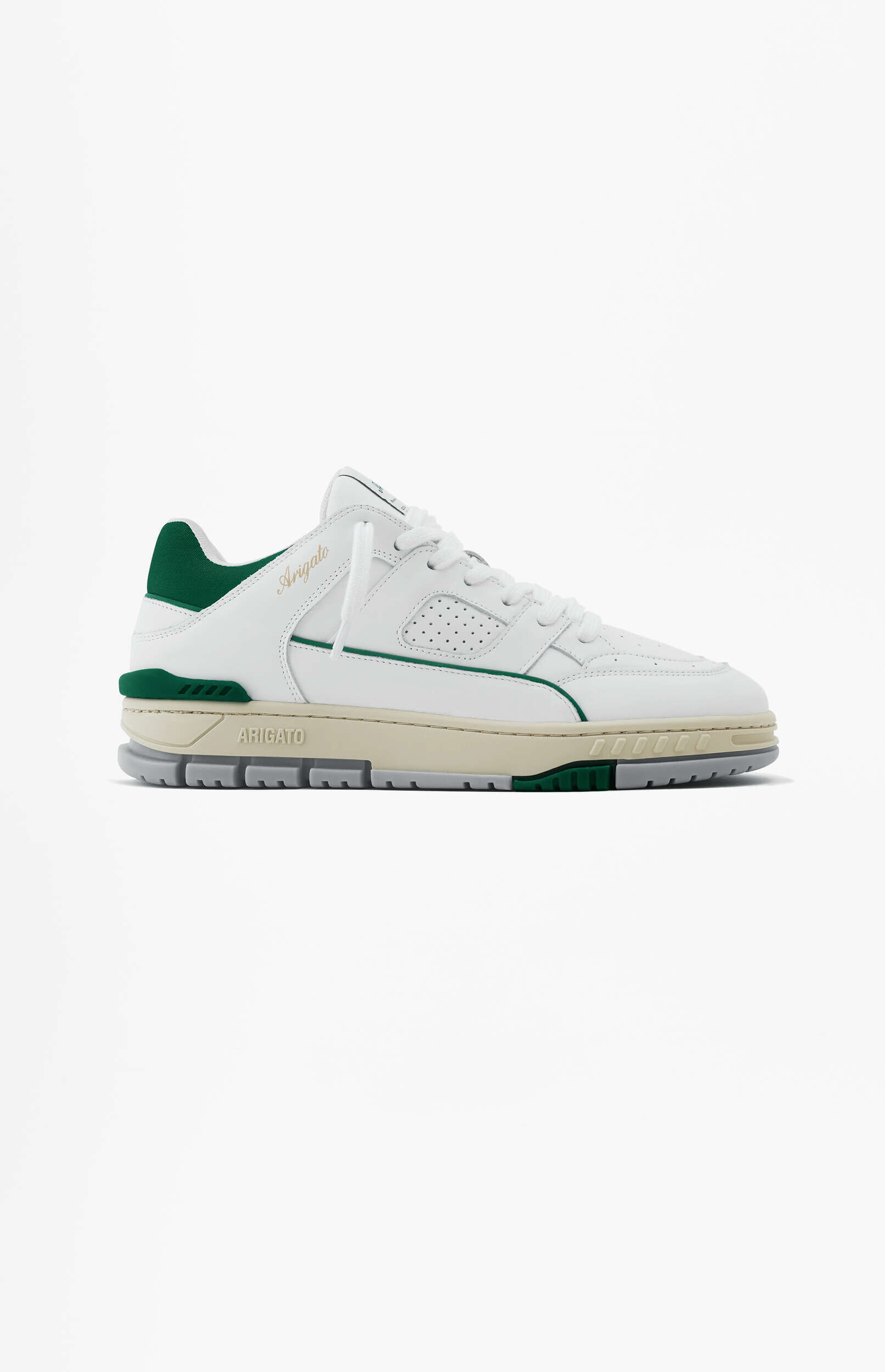 A clean shot of a white leather sneaker with dark green accents and a beige and grey sole. The word 'Arigato' is visible in gold script on the side and embossed on the midsole.
