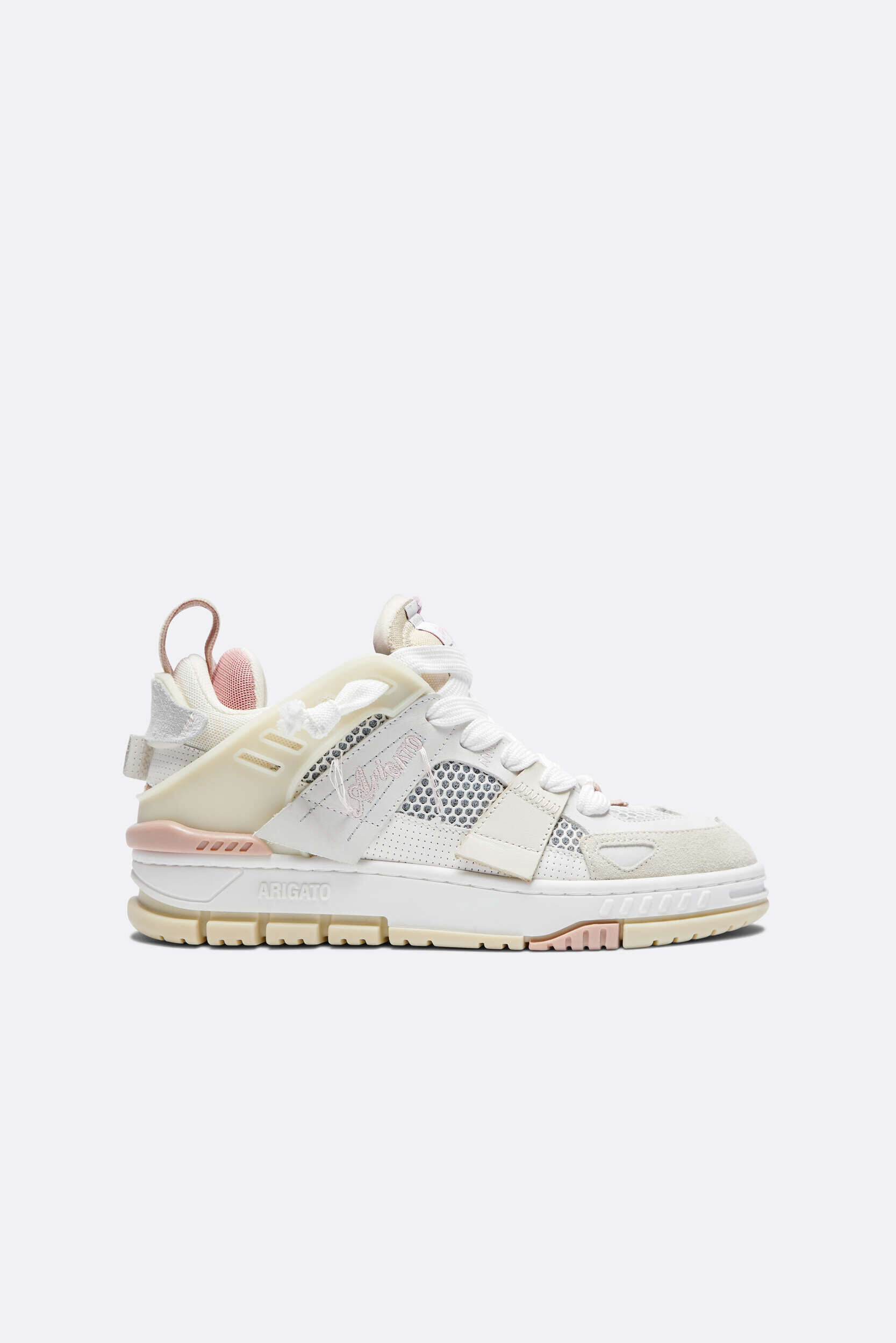 A white and cream Arigato brand sneaker with light pink accents, featuring a multi-textured design with mesh and leather, and a prominent chunky sole. The shoe is displayed against a clean white background.
