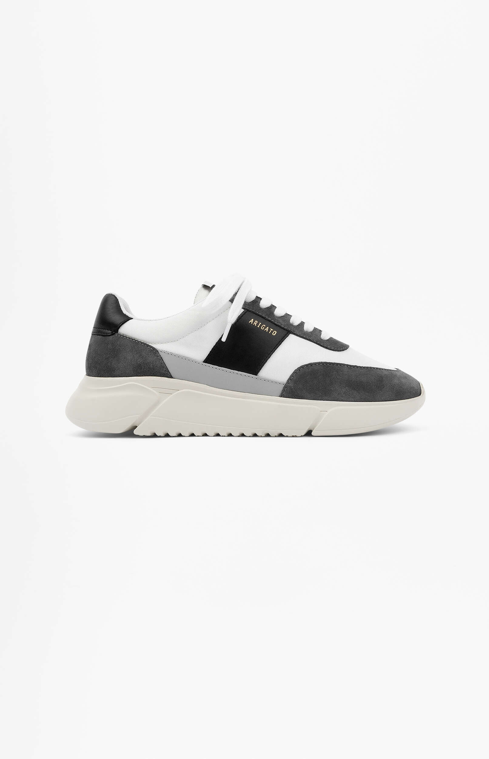 A single Axel Arigato Genesis Vintage Runner sneaker in white, grey, and black, viewed from the side on a white background. The shoe features white mesh panels, grey suede accents, a black side stripe with 'ARIGATO' in gold text, white laces, and a chunky off-white sole.
