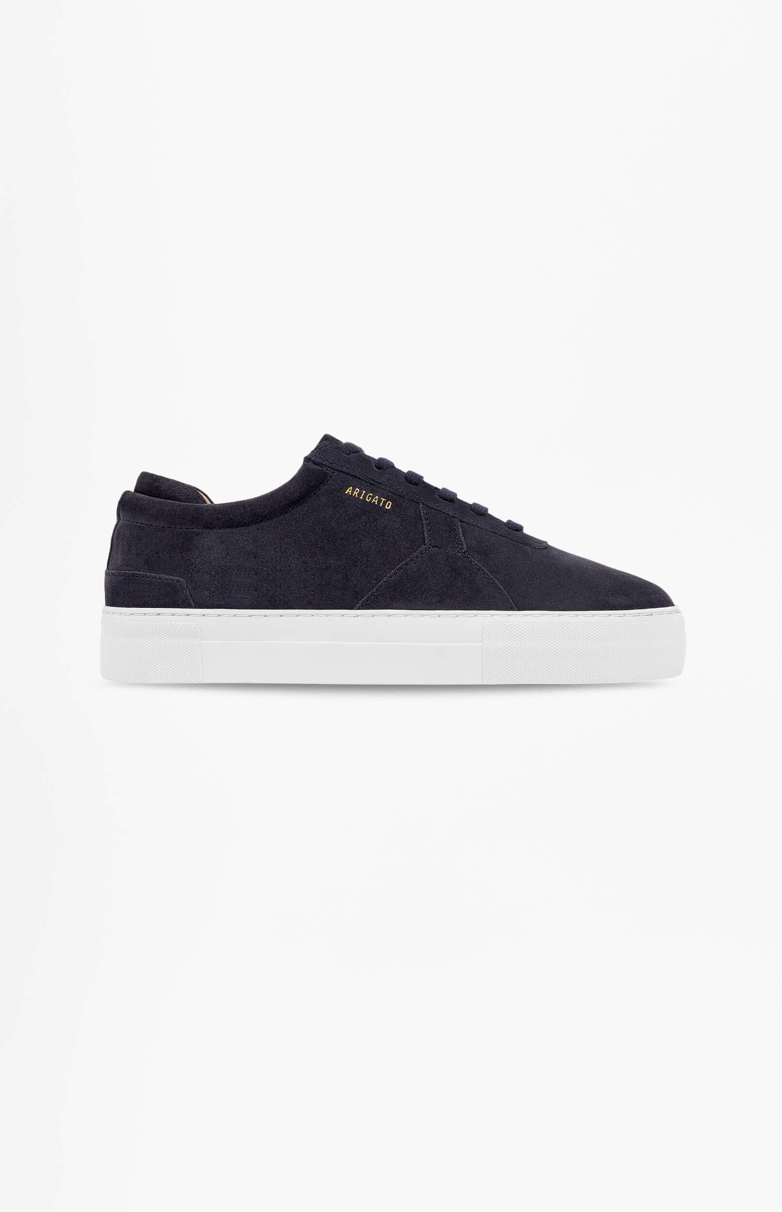 A single dark navy blue suede low-top sneaker with thick white rubber soles and 'ARIGATO' embossed in gold on the side, presented on a white background.