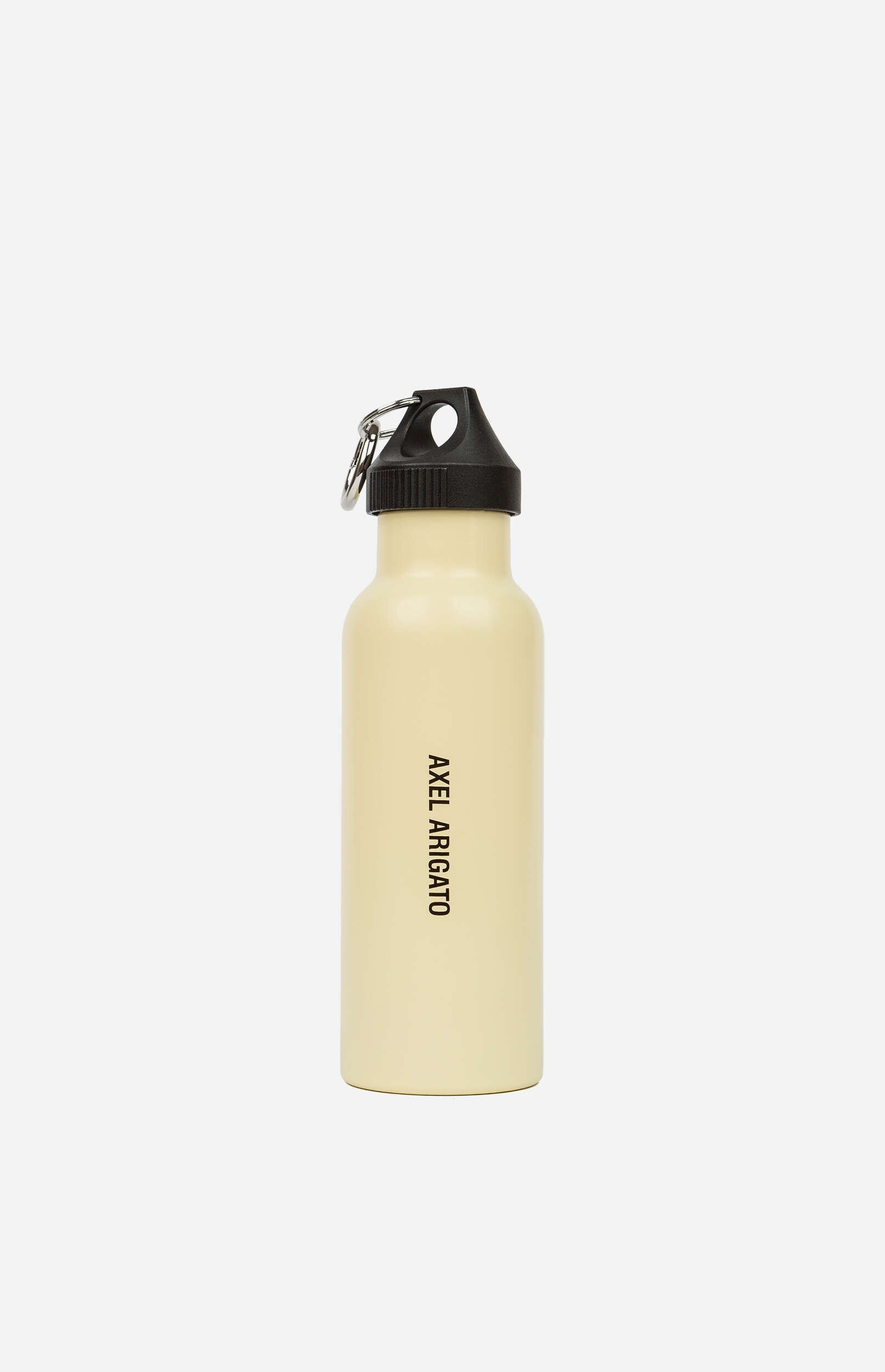 A cream-colored metal water bottle with a black screw cap and a silver keyring, featuring the brand name "AXEL ARIGATO" printed vertically in black on its side, against a plain white background.