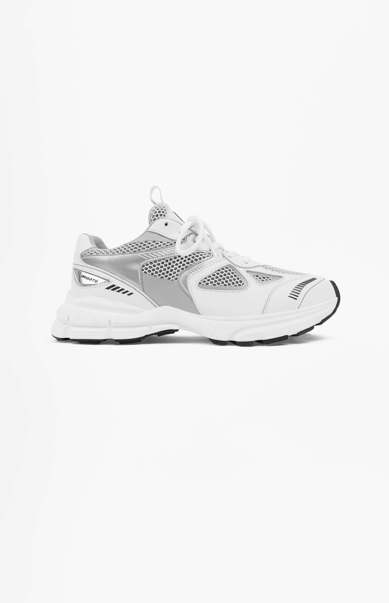 A white and silver BRIGATO athletic shoe with a chunky sole, mesh upper, and reflective details, angled to the right on a plain white background.