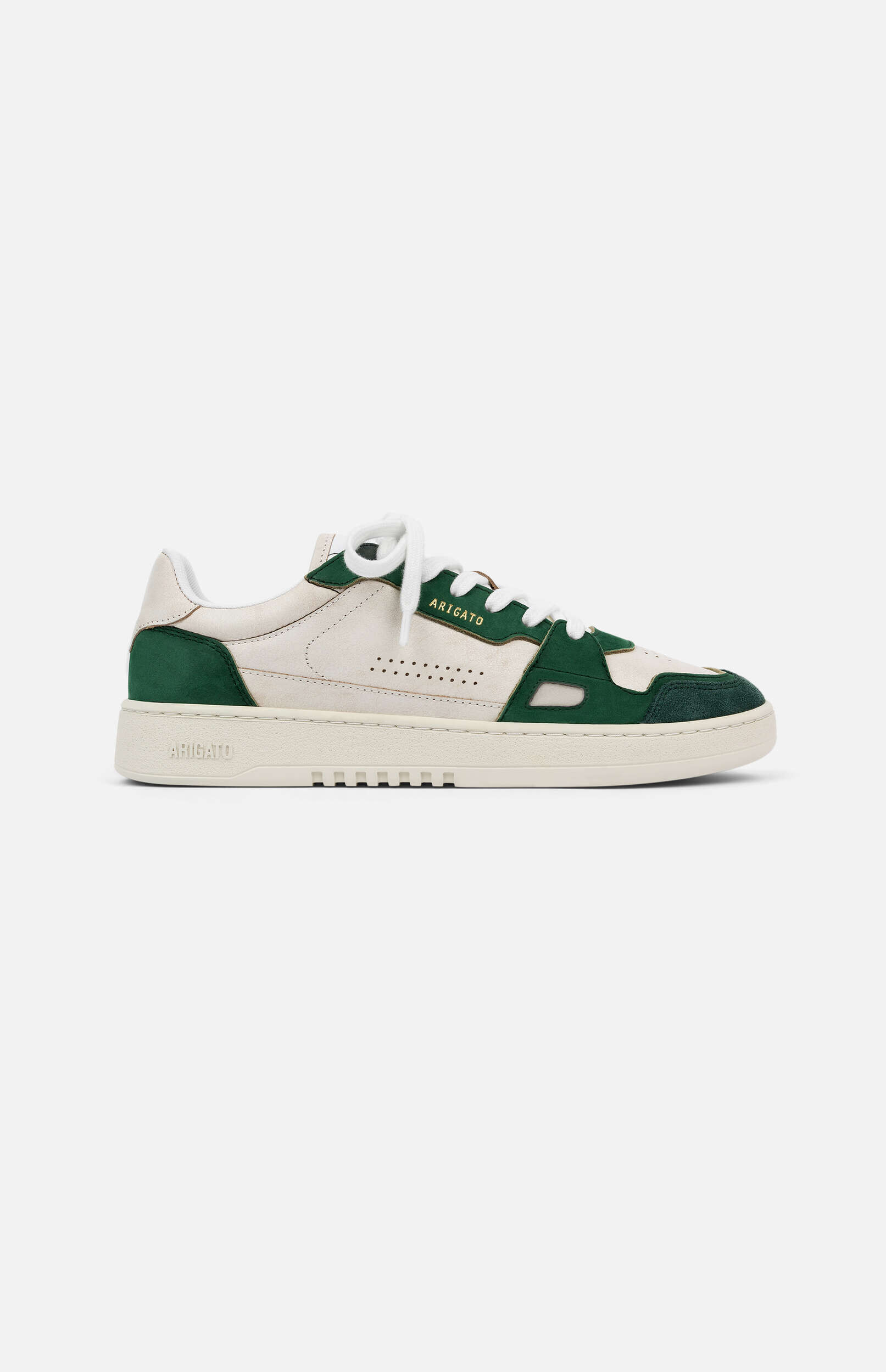 A single Axel Arigato low-top sneaker, primarily off-white with dark green suede and leather accents, white laces, and a thick off-white sole, presented on a light background.