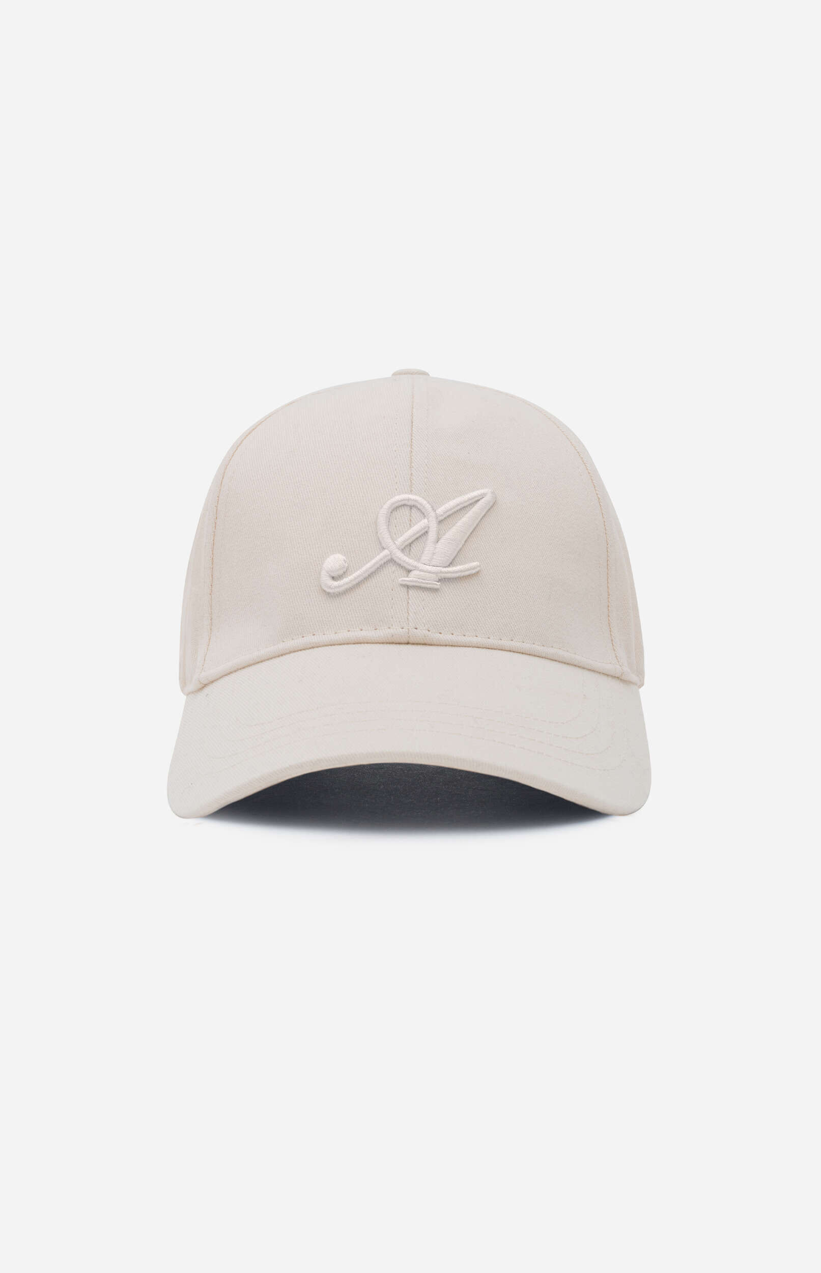 A light beige baseball cap with a subtle, raised embroidered logo resembling a stylized letter 'A' on the front, displayed against a plain light gray background.