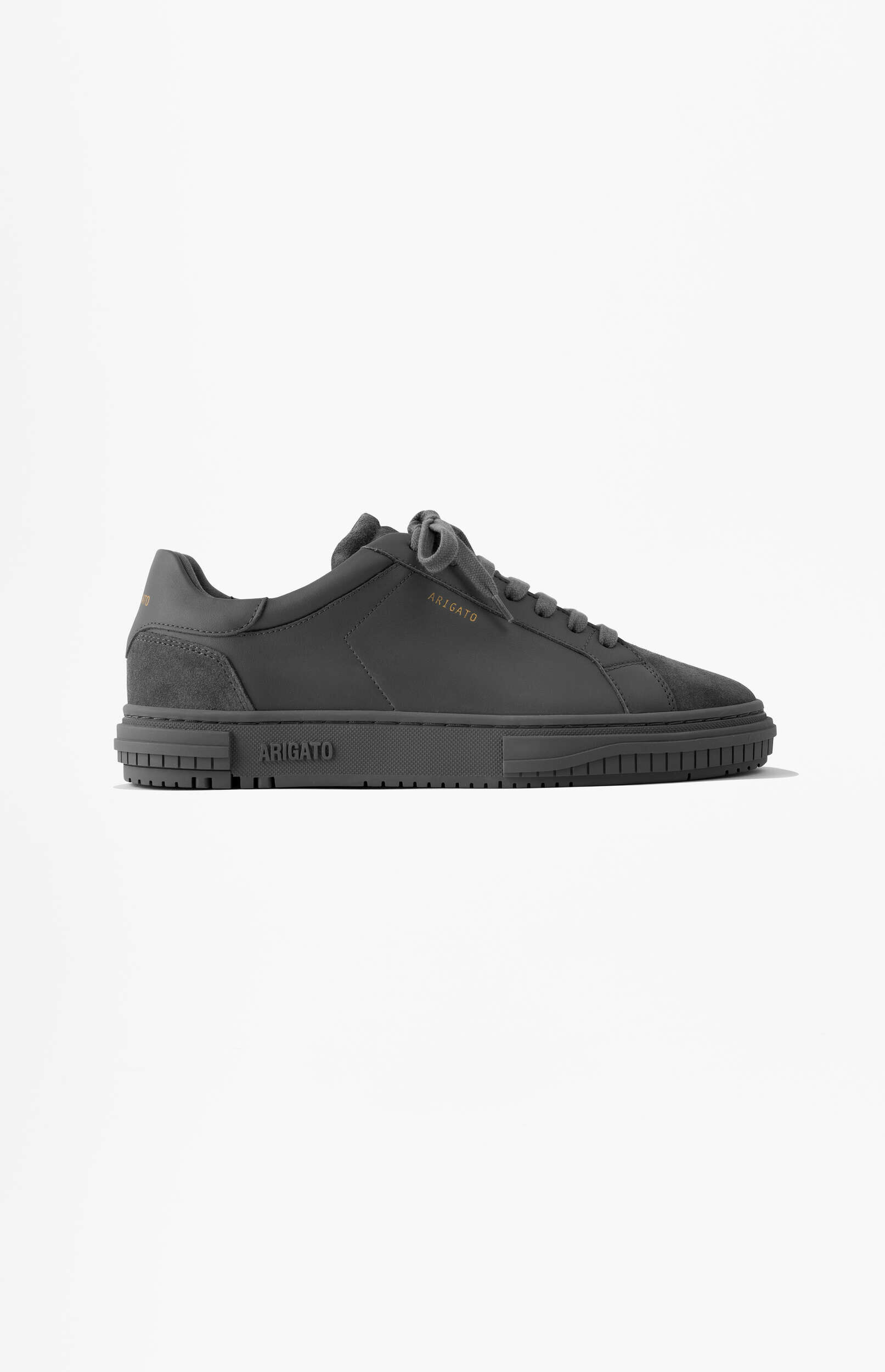 A single dark gray Axel Arigato Clean 90 sneaker with gold branding, displayed against a white background.