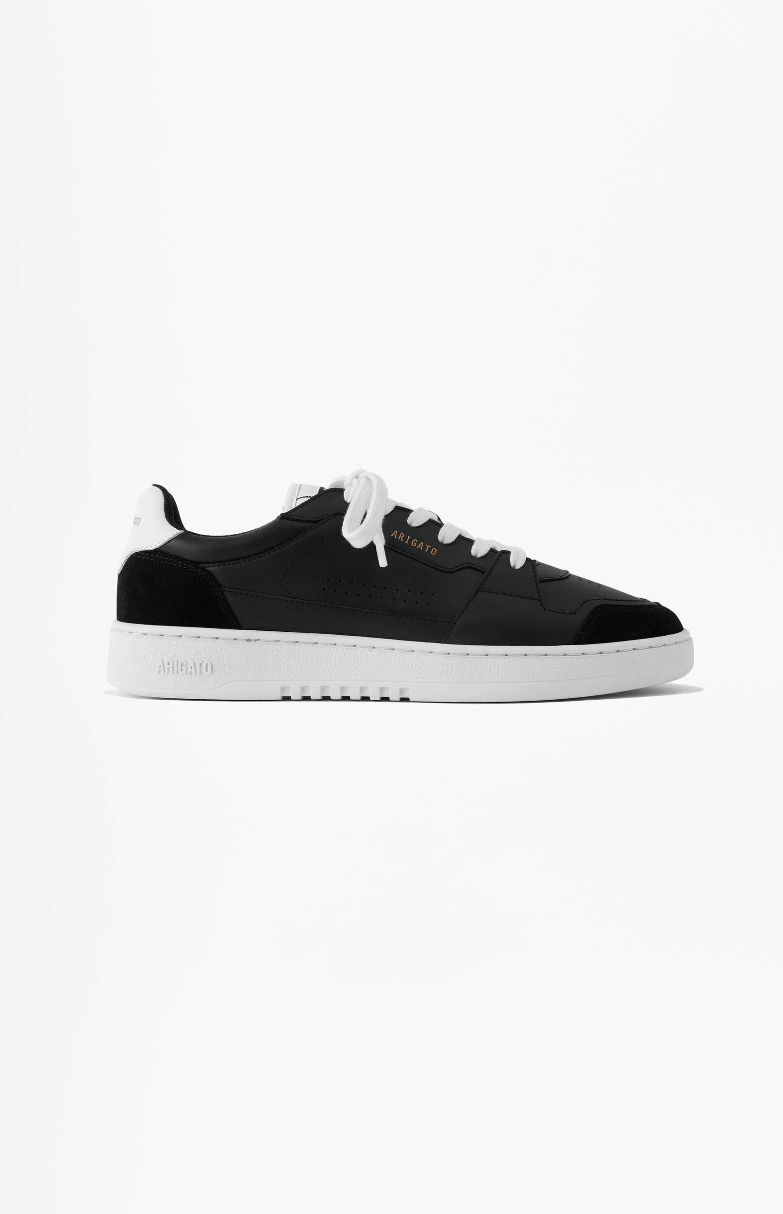 A single black Axel Arigato low-top sneaker with white laces and a thick white sole, featuring a gold 'ARIGATO' logo on the side and embossed on the heel, displayed on a clean white background.