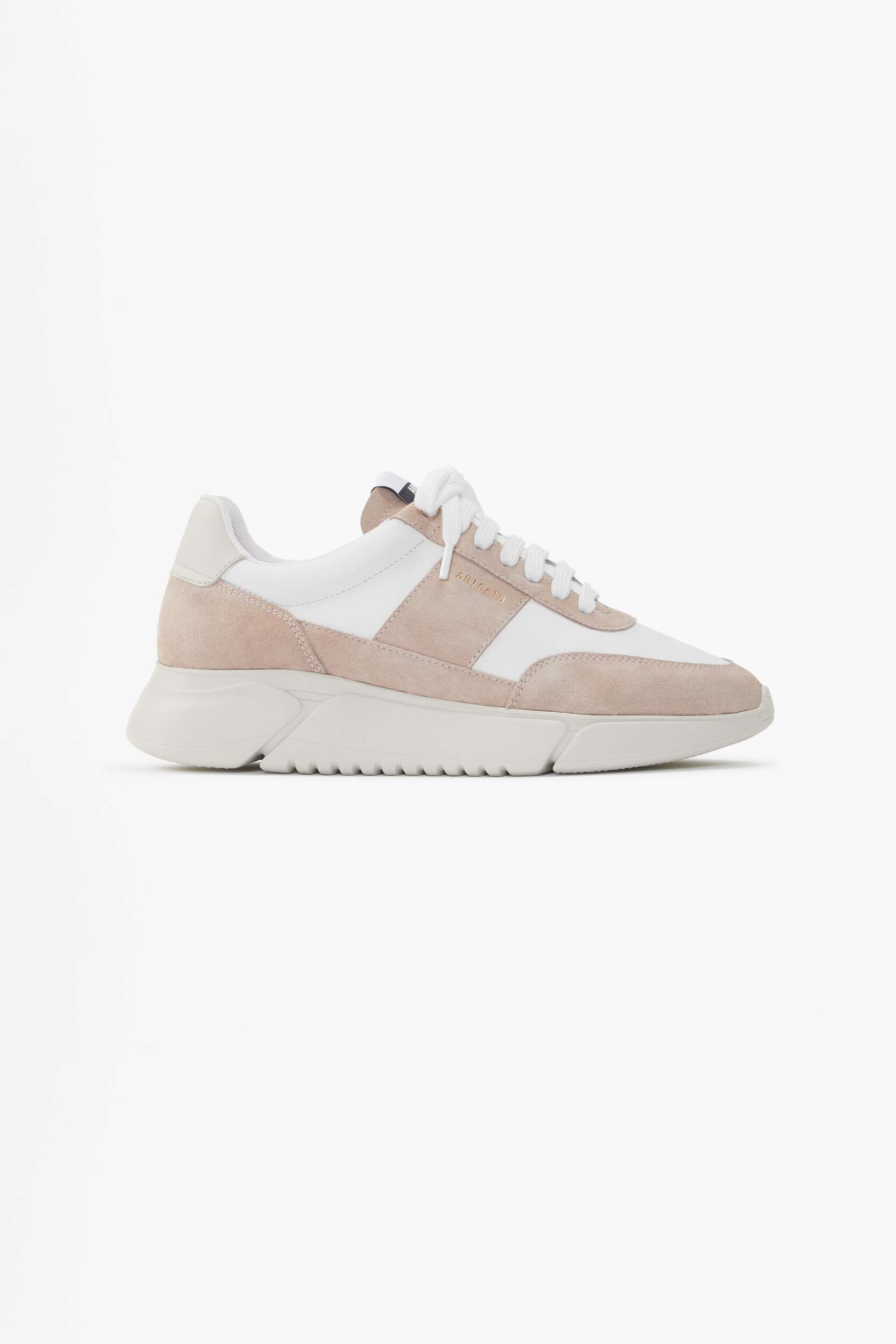 A side view of a modern white and light pink (blush) sneaker from Axel Arigato. The shoe features white leather panels, light pink suede accents, white laces, and a chunky cream-colored sole with subtle ridging. The brand name ARIGATO is subtly embossed on the outer side.